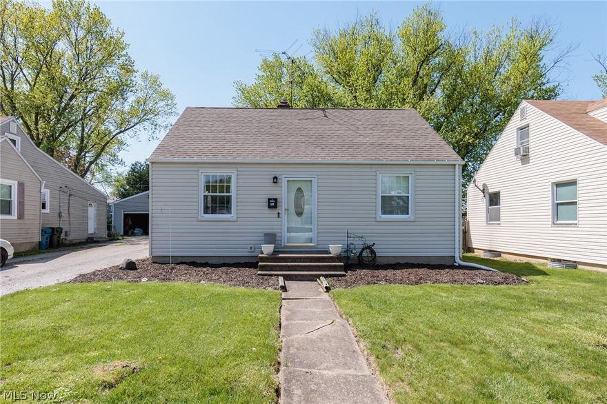 Cozy 3 bedroom, 1.5 bath bungalow on a quiet Sheffield Lake street just steps from Lake Erie! The first floor includes two bedrooms and a full bath, while the spacious upstairs primary bedroom offers room for a king sized bed, built-in bookshelves and great storage. A tidy kitchen overlooks the backyard and connects to the dining area and living room. Enjoy a large, shady, fully fenced yard this summer, ideal for pets, kids, play and outdoor entertaining! The full basement includes a commode and space to add a second bath. Recent updates include: new appliances (2020), privacy fence (2023), Furnace, AC (2019), sump pump, and waterproofing (2021). Ideal as a starter home, investment property, or a condo alternative without HOA fees. Convenient location two blocks from Lakewood Beach Park, with nearby highway access, shopping and lovely Freedom Park with pavilion at the end of the street!