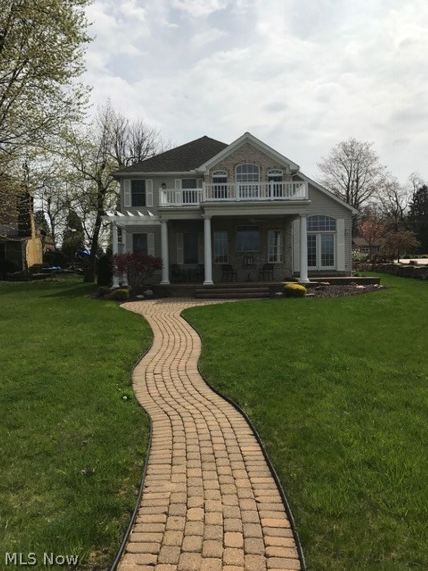 Lake Front. Brick and Vinyl 3 bedroom, 3 bath Design Basic 2 story home. Approx. 2200 sq. ft. 2 story foyer, 2 story Great Room with approx. 18 ft. ceilings with skylights and recessed lighting, fireplace. Formal Living Room, Kitchen with raised panel cabinets and granite counters, Pillared Dining area that opens onto an expansive paved brick patio overlooking the lake! 19X14 First floor Master Bedroom with bath that includes Garden Tub and separate shower and walk-in closet. 2nd floor has a 13X10 bedroom, 15X14 loft Bedroom, and a 13X8 loft over looking Great Room and Lake! Outside is a spacious level lot that has paved walk that walks out to new dock!