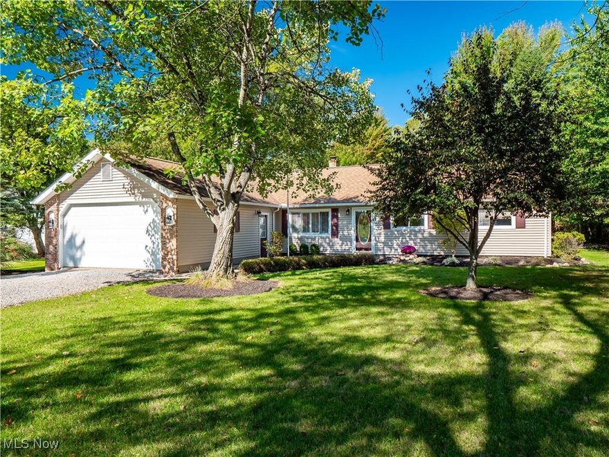 Welcome to this well-maintained, 3 bedroom, 1 bathroom farmhouse style ranch nestled on just about 1 acre of peaceful land. This home offers comfort and convenience with over 1500 square feet plus a bright sun room all in an amazing North Ridgeville location. At the front of the home is a classic living room that has beautiful trim detail with a coffered ceiling. Centering the home is the kitchen with granite countertops, tile backsplash, beautiful maple cabinetry, and a spacious dining area. Off of the kitchen is a more casual family room that has a sliding glass door leading to the cozy sunroom. Fun game nights and a more casual entertaining space can be found in the bonus room. Bedrooms are tucked away for added privacy. Newer flooring and fresh neutral paint throughout the home makes it easy to move in and match any decor. Step outside to discover an incredible outdoor area surrounded by beautiful mature trees complete with a beautiful brick paver patio and a fire pit. Completing the outdoors is a newer gravel driveway providing plenty of space for parking. With quick and easy access to major highways, this home is perfectly situated for commuters. Don’t miss your chance to enjoy both tranquil living and convenience in this charming ranch!