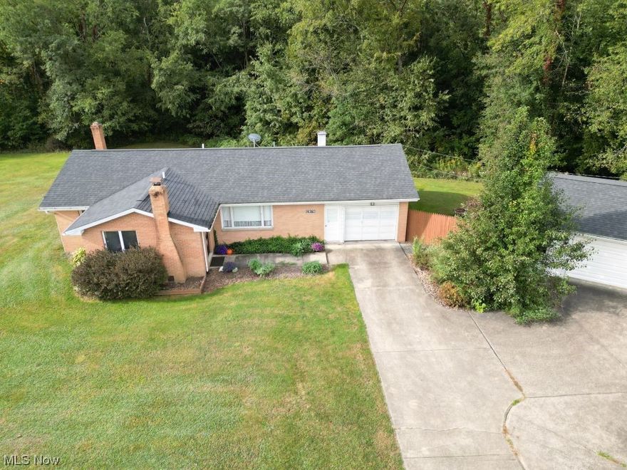 This charming 3-bedroom, 1-bath Brick Ranch home offers the perfect blend of comfort and functionality. With an attached 1-car garage and an additional 2-car detached garage, there's plenty of space for vehicles and storage. The paved driveway adds convenience, leading to a back deck that's perfect for outdoor gatherings. Inside, you'll find alluring hardwood flooring throughout, giving the home a warm and timeless feel. The bonus room in the basement, complete with a cozy fireplace, adds a touch of luxury and versatility to the space. Sitting on a little over an acre of land, this property also boasts a bonus Lilly Wood burner, ensuring both comfort and efficiency during the colder months. Selling home “as is”. Call today this one will not last long!