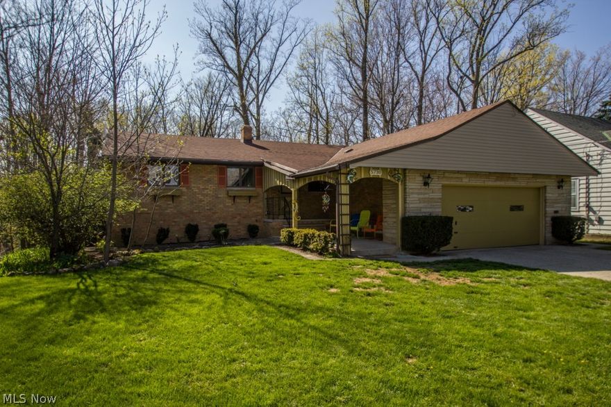 You will fall in love w/ this one-of-a-kind 2016 sq.ft, 4 bedroom, 2 full bath Ranch w/ finished walk-out basement nestled on a private homesite overlooking the Metroparks! Dramatic Great Room boasts refinished hardwood floors, cozy fireplace & over-sized slider windows leading to a sprawling covered deck embraced by sights & sounds of nature! Eat-in Kitchen equipped w/ all appliances, Amish custom built cabinets, new flooring, light fixtures & faucet! 3 generously sized bedrooms w/ refinished hardwood floors & updated full bath complete the main level. The sun lit Finished Walk-out lower level is a great space to entertain w/ a wet bar, fireplace, updated full bath, private 4th bedroom, laundry area, loads of storage space and large sliders leading out to the private backyard w/ brick paver patio, lush landscaping, and charming storage shed! A large list of improvements have been completed, allowing you to move right in and enjoy!