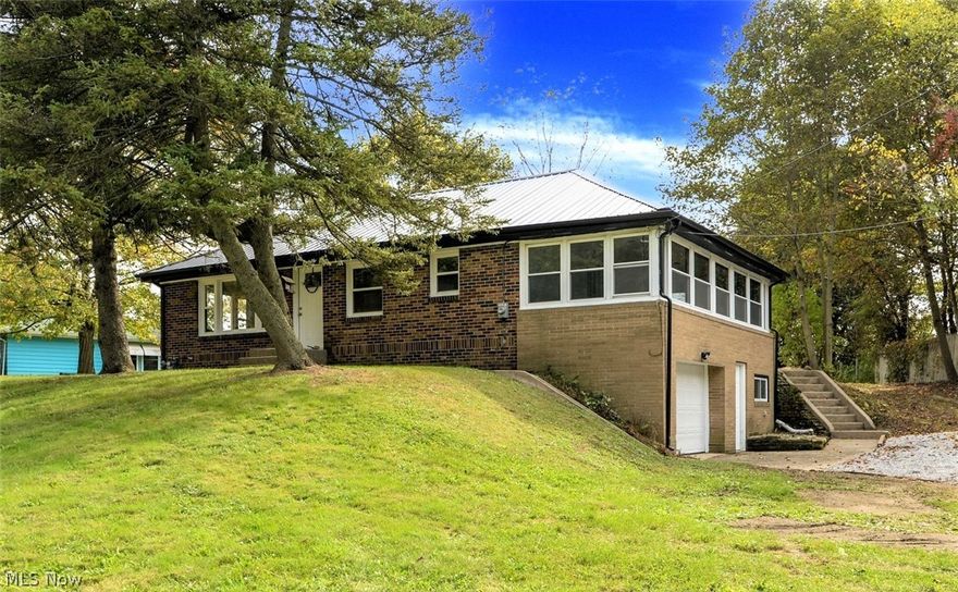 *Modern REMODELED All Brick Ranch W/1,610 Sq. Ft. Features 3 Bdrms, 1.5 Bathrms & Attached Garage On 1 ACRE OF LAND! *Enjoy A Spacious Back Yard W/Room To Roam & Land Of Your Own For Backyard BBQ's And Gatherings *FINISHED Walkout Basement And Sunroom! *UPDATES Include: New Black METAL ROOF Known For Lower AC Costs - Reflects Solar Heat + Extreme Durability Up To 70 Yrs., NEW FURNACE, NEW CENTRAL AIR, Doors, VINYL WINDOWS, Brand New KITCHEN, Brand New BATHROOMS, Grey Rustic LUXURY Plank Flooring, Carpet, Plumbing, Electrical *Entire Home Has Been Remodeled!! *Walk In To A Living Rm W/Dual Large Picture Windows *Arched Entryway To Eat In Kitchen W/BUTCHER BLOCK Countertops, White Arcadia Shaker Style CABINETS W/Oversized SS Hardware & Lazy Susan, Glass Jar Above Sink Pendant Lighting + Matching Triple Glass Jar Eat In Lighting, Double Flushmount Lights, SS Faucet W/Sprayer, SS/Black Oven & Dishwasher! *Gorgeous Sunroom W/Electric, Lighting, Plank Flooring Surrounded By 10 Polaris Window