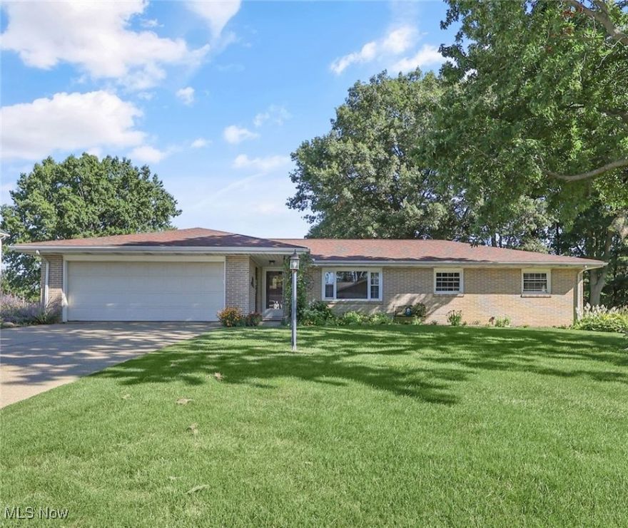 Here is that move-in ready brick ranch that you've been waiting for! This one has it all! Welcome to this meticulously maintained, sprawling 3 bedroom, 3 bath brick ranch, perfectly situated on a large, level lot in a highly desirable location. Conveniently located near the walking track, schools, shopping, restaurants, and offers prime views of the 4th of July fireworks, this home truly has something for everyone! Step onto the welcoming front porch and into a bright, open floor plan designed for both comfort and entertaining. The spacious kitchen flows seamlessly into the open dining area and family room complete with a gas fireplace. First-floor laundry with updated cabinetry, large closet and pantry provide storage galore and add to everyday convenience. The owner's suite provides a relaxing retreat, while two additional nicely sized bedrooms and a guest bath complete the main level. Car enthusiasts and hobbyists alike will love the heated and cooled 2-car garage featuring glazed tile walls, indoor water hookups, and a large concrete driveway with plenty of parking. The partially finished basement expands your living space with a versatile recreation room or potential 4th bedroom, a full bath, an abundance of storage, and a bright 14' x 25' workshop perfect for any project. Outside, enjoy your mornings and evenings on the beautiful patio overlooking the fenced-in backyard and beautiful perennials—a perfect space for relaxation or entertaining. Recent upgrades include Furnace, A/C, roof shingles, hot water heater, carpeting and flooring. This home is truly move-in ready and waiting for you to make it yours. Call your favorite Realtor today and get ready to call this stunning brick beauty “HOME.”