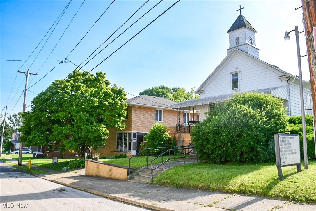 Prime opportunity in the heart of Barberton! This stand-alone commercial property at 128 21st NW offers over 3,000 sq ft of versatile space and is currently operating as a church. Thoughtfully designed for gathering and function, the building features a spacious main sanctuary, a welcoming fellowship hall, a full kitchen, three bathrooms, and convenient side-entry handicap accessibility.
Situated within walking distance to the Barberton Movie Theater, scenic Lake Anna, and the vibrant Downtown Barberton district, this location provides ideal exposure and accessibility for a variety of uses. Whether you envision continued religious services, an event venue, nonprofit headquarters, or a creative commercial conversion — the possibilities are truly expansive.
Positioned next to a separately listed residential home at MLS#5126327, this property invites opportunity for buyers exploring combined or complementary use. Explore the potential.