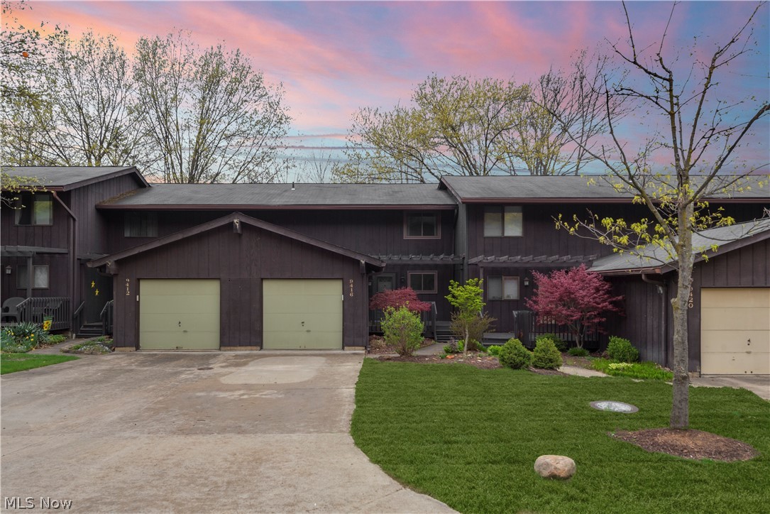 Welcome Home! This stylish, Buntingtree Townhome features beautiful updates throughout the spacious floor plan. Walk right in from either your attached garage or the front deck to a foyer leading you into the newly renovated kitchen (2018). Every single detail has been completely agonized over and it shows. From quartz counters to the metal subway tile to stunning custom cabinets to the appliance suite that stays with the home. Along with the kitchen, the main floor provides a balcony off of the dining room and a large living room with modern woodgrain tile as well as a fully renovated half bath. Down stairs, you will be greeted by another large living area with contemporary flooring, a sliding glass door that walks out to a patio and utility room complete with a full bathroom. upstairs there are 3 bedrooms and another fully renovated full bath. The main bath features granite top vanities, trendy lighting and a large tub. This home is all electric and features a newer A/C unit (201