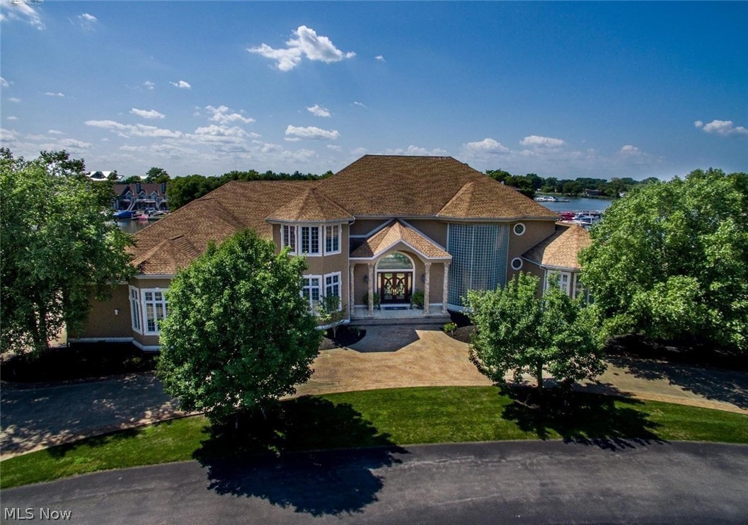 Mediterranean Style Estate in Gated Community. A truly spectacular waterfront home with stunning views will make every day seem like a vacation. Located in Sandusky Ohio voted the Best Small Town Coastal City by USA Today. Imagine summer days resting by the pool.Dock your boat at your 258 foot sea wall or cruise over to the Cedar Point Amusement Park's sandy beach just across the bay or maybe Put in Bay. Rainy Day? Don't Fret. Relax with your friends in the 18 seat theater room. Car Buff? Your garage will have room for 8 cars. Do you like to entertain? This is the perfect party home. Your dream kitchen is complete with Viking Range, 2 ovens, over sized refrigerator and freezer plus a wine storage rooms Finished basement... don't worry about the steps, the elevator stops at all levels. This home is just too amazing for words. Home's exterior was freshly painted in 2018. Owner is Licensed Associate Broker.