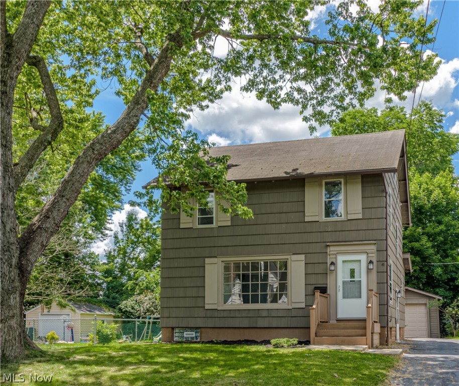 Here's a spacious Colonial that has been extensively updated in a desireable Cuyahoga Falls location just off of Broad Blvd. Light,bright and open. Freshly painted throughout with tasteful neutral colors .Step into the large living room filled with natural light from the over sized picture window, decorative fireplace, and new carpet. Formal dining room with new laminate floor that continues into the cozy family room that has a wood burner for extra warmth in the winter. The kitchen has been gutted and completely updated with new cabinets, counters,attractive back splash, and stainless appliances. Three spacious bedrooms on the second floor plus a nicely finished third floor. Attractive full bath with double sinks and ceramic tile floor. Screen porch overlooks fenced backyard. Electric updated by Thompson Electric who replaced the electric panel box and the wiring throughout the house.