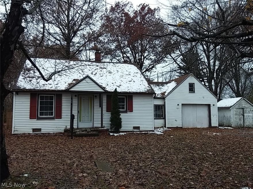 Cozy little 2 bedroom bungalow with kitchen, living room, breezeway between house and garage.  Needs some TLC but has lots of potential.