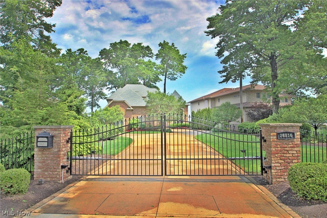 Extraordinary may fall short of properly describing this prestigious gated home overlooking Lake Erie. A grand 2 story entrance welcomes your guests to enjoy the comfort and breathtaking views this majestic home offers. Custom built with extreme attention to detail, and the highest quality finishes including polished stone floors, granite, coffered ceilings, and moldings throughout. Gourmet dream kitchen, unbelievable great room, ultimate master suite, 2 story study, and 2nd floor family room with wet bar. The lower level is a true showplace offering a 250 bottle wine cellar, full bar, bedroom, full bath with steam shower, and everlasting entertainment. Outside there is more…beautiful stone patio, fire pit, and million dollar panoramic views of Lake Erie. Bay village has been rated as one of the top communities in all of Northern Ohio! Family-oriented community with excellent schools, many activities, lots of green space, a recently certified Blue Wave beach, and great walkable neighbo