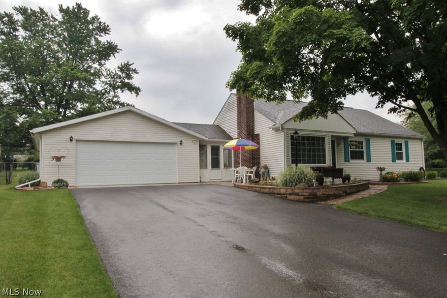 PERFECT describes this beautiful updated home located on a corner lot in established north-end subdivision. No painting or cleaning needed!!  Updates include new flooring in kitchen & bath; beautifully refinished hardwood floors; new windows in 2011; driveway,2012; lg. patio in 2013; all new appliances will remain; replaced light fixtures & ceiling fans; all new water drainage around outside of home & in yard.  You'll love the over-sized 30x25  well insulated garage with separate gas furnace & oodles of storage plus workshop. Sit &  enjoy your morning coffee in the enclosed breezeway off the kitchen. Would be a great first home or perfect for those of you who are needing to down-size. Fireplace has been closed as they use electric logs.  Home is very efficient with low utility bills.