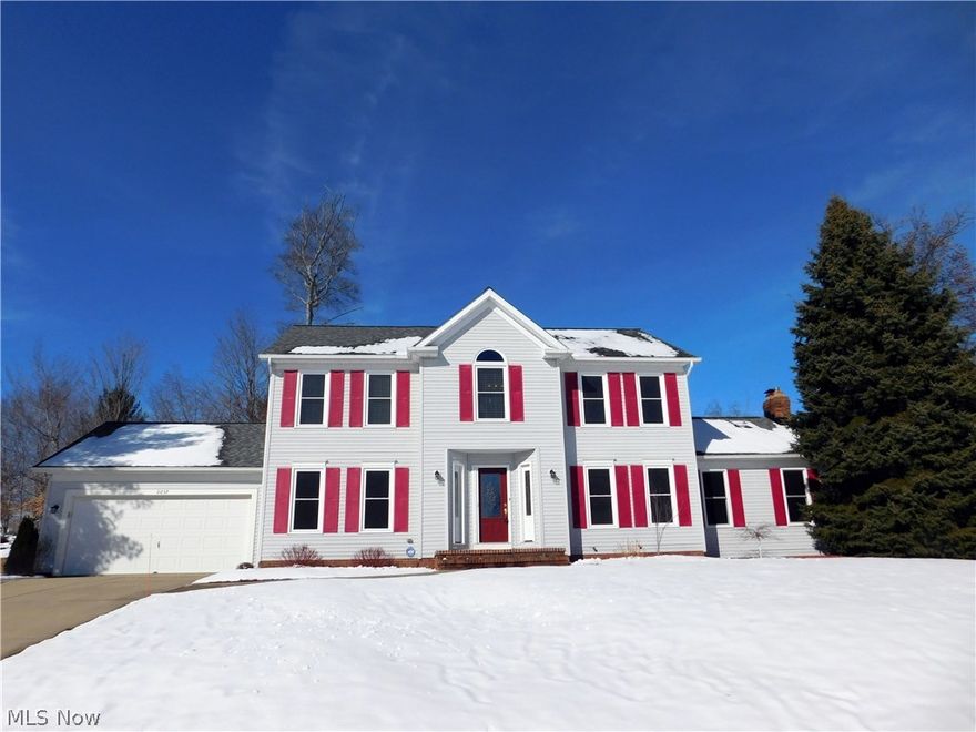Fabulous colonial in Twinsburg's desirable Ethans Green development!  Enter this four BR home through the newer front door into the two story foyer with new 3/4" red oak hardwood floors (2016), flanked by the living room/office on the left and formal dining room on the right.  Open eat-in kitchen with plenty of cabinets & newer counters, center island, newer appliances (2012), and sliding glass door leading to rear grounds with custom paver patio and privacy. The vaulted family room boasts generous space, bay area, and gas fireplace. 1st floor laundry room with cabinets, closet and sitting bench with newer washer and dryer (2012) included. Updated half bath also on 1st. Second floor features master suite with raised ceiling, master bathroom with corner jetted tub, separate shower, double sink vanities, and a spacious walk-in closet.  Three additional bedrooms with solid hardwood bamboo flooring (2014-15) and 2nd full bath! Lower level is partially finished with tons of storage space in
