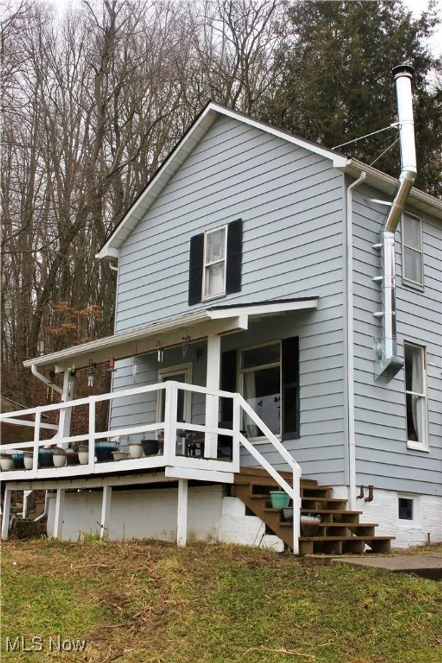 Hobby farm ready and waiting for your homestead dreams. All interior spaces have been fully redone and are move-in ready, allowing you to add your own finishing touches. Enjoy a beautiful view from the freshly painted exterior and relax on the front porch while taking in the surrounding wildlife. A new roof in 2023 adds peace of mind. A rare opportunity for peaceful country living with modern updates.