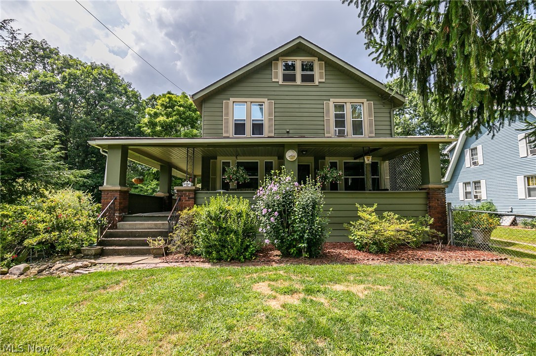 A wonderful, early century charmer in Stow. With over 1900 sq ft, this home features 4 bedrooms, and 2 full baths. The wrap around front porch extends almost 70 feet, and covers the front and side. The oversized living room has a beautiful fireplace, and opens to the large living room. A large lot is completely fenced, with a patio and additional covered rear porch. There is a basement, shed, vinyl windows, a second floor laundry, and so much more.
