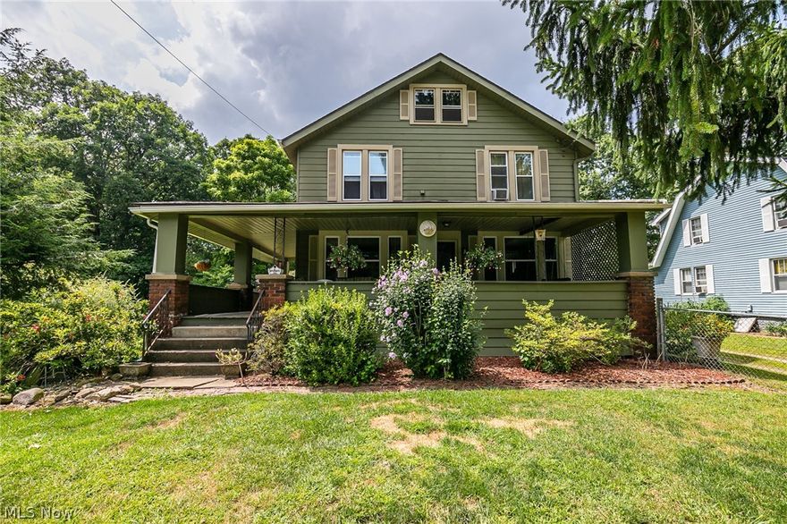 A wonderful, early century charmer in Stow.  With over 1900 sq ft, this home features 4 bedrooms, and 2 full baths.  The wrap around front porch extends almost 70 feet, and covers the front and side.  The oversized living room has a beautiful fireplace, and opens to the large living room.  A large lot is completely fenced, with a patio and additional covered rear porch.  There is a basement, shed, vinyl windows, a second floor laundry, and so much more.