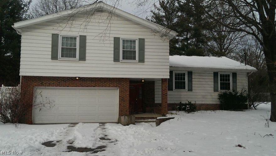 Make sure to check out this fantastic opportunity! Truly one-of-a-kind chance to make this home your own! Hardwood floors under the carpet, through most of the rooms, large entertaining areas, many updated touches and conveniences and so much more! Newer High Efficient furnace and hot water tank. The kitchen already has granite counter top on the island and a newer high-end faucet, just needs the finishing touches! Large sunroom/den with a wet bar over-looks the fenced in back yard, deck and hot tub (condition of hot tub unknown but has never been winterized). A second, family room on the ground floor level with a gas fireplace makes a great spot for cozy entertaining during the winter. Large bedrooms with hardwood floors under the carpet just seals the deal! Master bedroom has fireplace and en suite bath! Don't miss out on this opportunity and schedule your showing today. Short Sale.