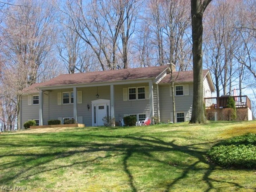 Wow!  Beautifully updated 4 bedroom 2.5 bath Bi-level on a deep wooded lot.  Rich hardwood floors.  Big bright kitchen and eating area.  Large living and dining with wood burning fireplace overlooking the large private lot.  Major updates include all new windows and doors, new furnace, central air and roof in 2012!  Nice master suite with half bath.  Walkout lower level with lots of windows and light includes a family room, 2nd fireplace, bar and full bath.  Reverse osmosis, updated hot water tank and so much more!  Sharon Township - Highland Schools.