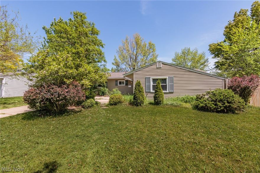 Welcome to this updated North Ridgeville Ranch! Offering one-level living with new flooring throughout most of the house. The living room is spacious and offers access to the patio and generous backyard. An open dining area off of the living room leads into the kitchen with updated stainless steel appliances. Off the other side of the living room is a den that also has views and access to the backyard. The master bedroom is fresh and serene and has a private one-suite half bath. Three additional bedrooms and a full guest bath complete the floorplan. Outside there is a two-car garage ready to be joined to the driveway by the new owners. Located on a quiet tree-lined street but still has quick and easy access to I-480 and other amenities. Offer deadline 8pm 5/23.