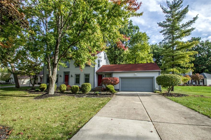 Charming colonial surrounded by trees that backs onto the FoxCreek Golf & Raquet Club. This house truly has it ALL! Great location not only for the golf course but also close to the lake. Inviting foyer that is flanked by a cozy sitting room with lots of natural light and a formal dining room. The kitchen opens to a large family room complete with brick fireplace and built-ins and has access to the gorgeous back deck. It's a perfect space to enjoy the cold Ohio winters. The backyard is breathtaking and the numerous trees provides a tranquil space; front yard is also spacious and well maintained. Laundry room is outfitted with counter top, sink and cupboard space to make things easy and leads out to the meticulous 2 car garage. Upstairs bedrooms are spacious with plenty of closet space. Master bedroom has full bath with jacuzzi tub as well as walk-in closet. Carpeting throughout the home is brand new. Full finished walk out basement offers possible in-law suite or space to rent out. Kit