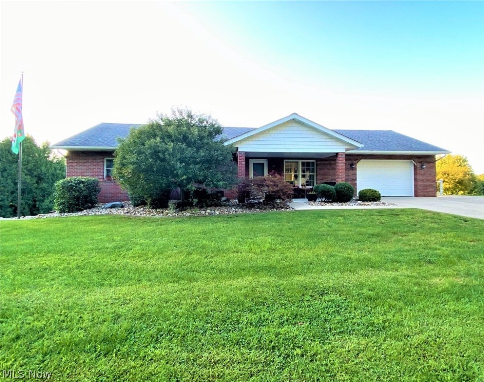 This is a must see! Beautifully remodeled all-brick ranch just on the outskirts of town on over 2 acres! This home features all new Karndean flooring on both the main floor and the basement. Main level kitchen has new custom Shutler Cabinets, basement has new custom Amish-made cabinets. The basement is completely finished with a living area, full kitchen, and has the 2nd bath and 3rd bedroom which would make a wonderful separate living space or possible in-law suite. Brand new deck installed in 2021 that is 730 sq ft of fiberon decking and also a new concrete patio that is a walkout from the basement.