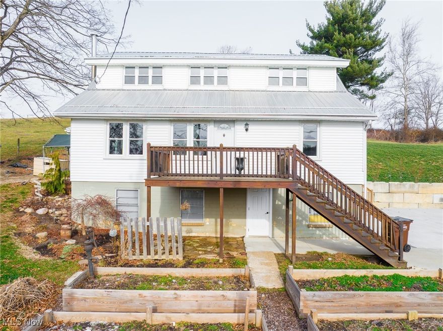 Selling at auction, located just north of Millersburg, Ohio, this property is a rare gem for anyone seeking an affordable home with acreage on a quiet country road. Situated on 2.3+ acres, this five-bedroom, one-and-a-half-bath home offers endless potential and plenty of room to grow. The main level features a welcoming entry with a half bath, a spacious kitchen flowing into a living room area that could be transformed into an open, inviting space with a little remodeling, along with a full bath and two main-floor bedrooms. Upstairs, you’ll find three additional bedrooms, making this home ideal for families or those needing extra space. Some updates have already been completed, allowing you to move in and make it your own. Outside, a large garage/shed-style building across the driveway provides excellent storage or workspace, while the expansive backyard offers privacy and includes a small wooded area—perfect for outdoor enjoyment or even a bit of hunting. This property offers peaceful living, usable acreage, and great potential!