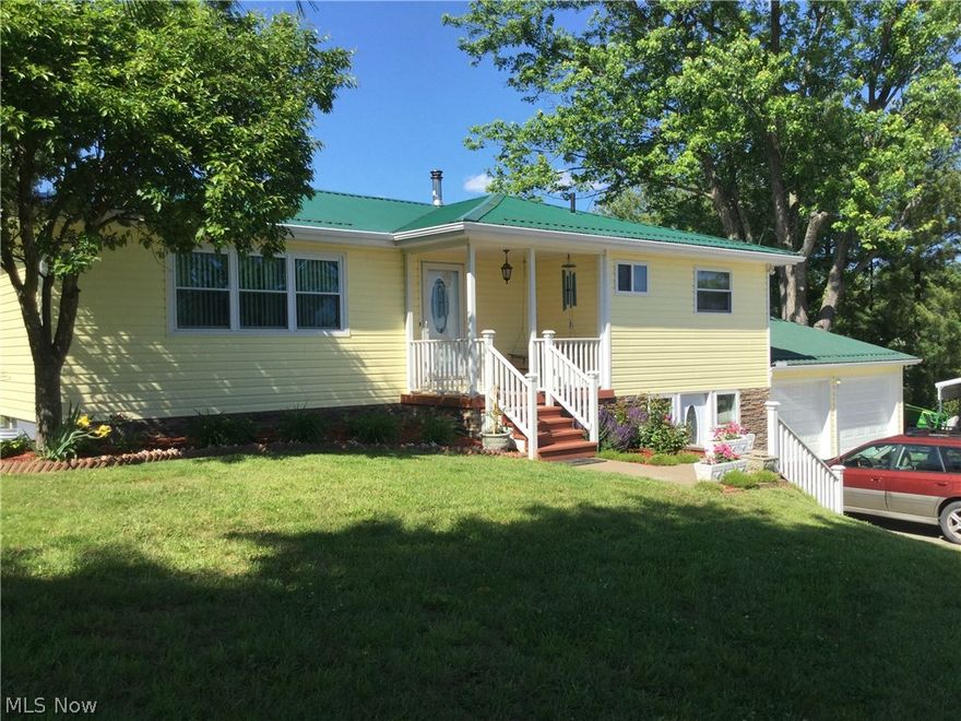 This home has been recently renovated, including windows, doors, siding, roof, plumbing, 200 AMP electric, heat pump, hot water tank and water softener.  Laundry room in lower level is also the 2nd full bath.  The lower level is plumbed for 2nd kitchen (17x11).  Family room features a Buck wood burning stove.  In addition to the attached garage there is also a carport.