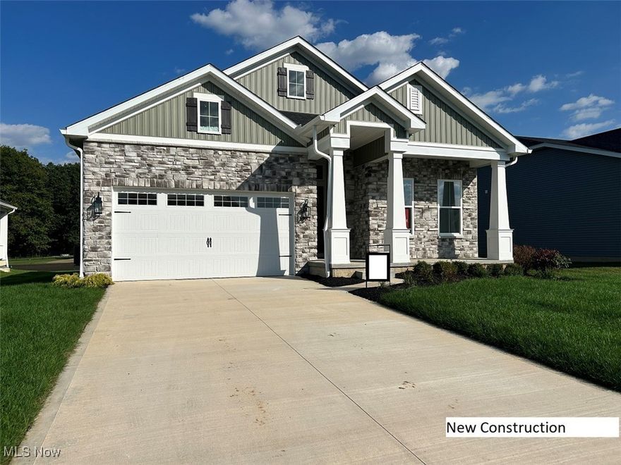 New ranch home in Marblehead’s newest community, ready early Spring 2026. The Asheville showcases impressive vaulted ceilings and an abundance of windows that flood the home with natural light. The great room is the showpiece, featuring stained wood ceiling beams, farmhouse-style shiplap accents, and a full-wall stone fireplace, creating a warm and striking focal point. The chef-inspired kitchen includes a dramatic hooded vent, large island, walk-in pantry, and beautiful white GE Café appliances. The open layout flows from kitchen to dining to great room, offering an ideal setup for entertaining or everyday comfort. The private primary suite provides a spa-like retreat with a relaxing soaker tub, dual vanities, and an expansive walk-in closet. Bedrooms 2 and 3 are positioned near a full hall bath off the foyer, perfect for guests or family. Additional highlights include a covered patio, a convenient HovHall off the 2-car garage for everyday organization, and an included washer and dryer—making this home truly move-in ready. With its vaulted, shiplap-and-beam accented ceilings, bright airy spaces, and timeless finishes, this brand-new home offers both comfort and style near the shores of Lake Erie. Just pack your bags and settle right in.