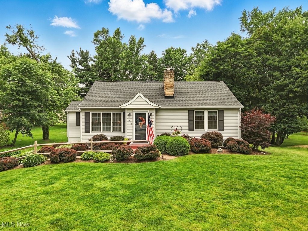 A Pristine Home in a Serene Setting! This beautiful Cape Cod offers charm, space, and thoughtful updates throughout. Step into the spacious living room with rare extra-wide molding and a cozy wood-burning fireplace. Entertain effortlessly in the chef's dream kitchen featuring solid wood custom cabinets, granite countertops, stainless appliances, pantry, and a breakfast bar plus a large dining area with plenty of room for gatherings. The first-floor owner's suite boasts an ensuite bath, walk-in closet, and easy access to the covered back porch, perfect for morning coffee overlooking the lush, private backyard. Two guest bedrooms, a full bath, and a charming reading nook complete the main level. Upstairs, a large 4th bedroom features built-ins, wainscoting, and abundant storage. The lower level offers a warm and rustic rec room with barn siding from an 1889 barn, a second wood burning
fireplace, and a wet bar with refrigerator. You'll also find a finished bonus room ideal for an office, gym, or playroom, plus a well-equipped laundry area with sink and shelving. The walk-out basement includes a workshop, extra storage, and leads to a covered brick paver patio, fenced backyard, and fire pit. An oversized 2+ car garage, storage shed, and fenced storage area provide ample room for all your tools and toys. This home combines classic charm with modern function and serene outdoor spaces. You'll want to say yes to this address!