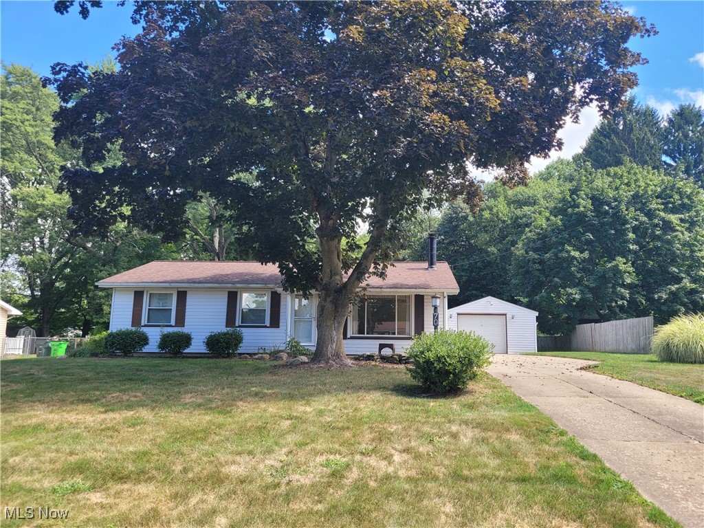 Welcome to this fantastic Ranch in Munroe Falls! Nestled on .82 acres, this 3 bdrm, 1.5 bath with shower in the basement, has numerous updates including: HVAC, HWT, roof, garage door, windows throughout, and more! Gas range in open, eat-in kitchen with bayed windows and hickory stained cabinets everywhere. Fully applianced with fridge, range, stove and DW. Huge picture window in living room with gas FP. Hardwood floors lie beneath carpet throughout. Master bedroom with 1/2 bath attached. Fully updated full bath in hall. Basement has concrete reinforced walls professionally painted and I-Beam construction. 2 workshop rooms and semi finished with vinyl flooring. Drop ceilings in shop rooms. 8x10 shed conveys. Parcels are shaped like a Capital T in the back accumulating almost an acre of greenspace. Screened in porch for those late evenings!