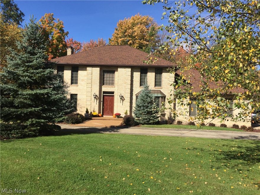 Fabulous all Brick classic Georgian colonial!  Exceptional first impression as you pull up to the large horseshoe drive, nature stone porch, and custom hardwood entry door. Grand foyer w/hardwood flooring & crown molding includes two closets w/solid hardwood 6 panel doors. Spacious dining room w/bay window. Living room  w/plenty of windows & space to relax. Family room wood fireplace w/gas starter is flanked by built in wood bookshelves & custom tile. Two sets of French doors walk into the glorious Sun Room, 21' x 14', w/vaulted ceiling & beautiful garden sink for your favorite plants. Windows on 3 walls with a sliding door to access the patio. Sun Room is part of the whole house heating & a/c system to enjoy year round. Family Room opens to large kitchen with the same beautiful hardwood flooring that flows from the foyer. Kitchen equipped w/updated stainless steel appliances (2013), including double wall oven. Island with second prep sink, perfectly sized eat in area for a large table