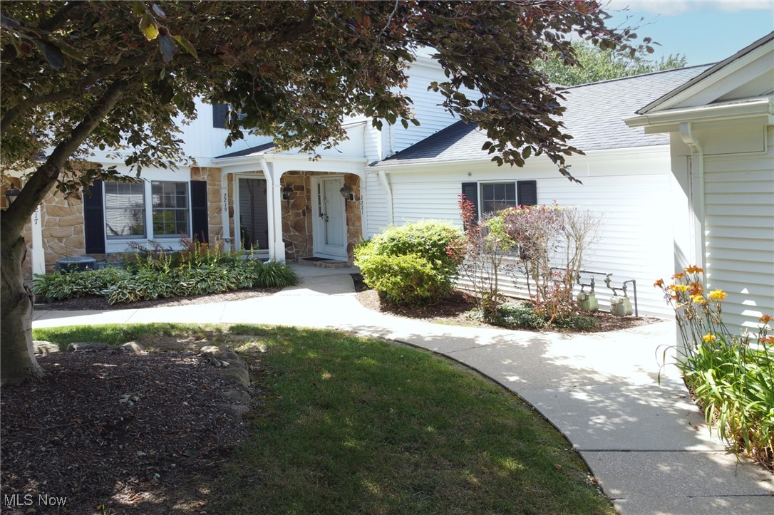 Highly desirable North Hudson condominium overlooking the 10th Fairway features beautiful panoramic golf course views. High end design renovations throughout. Stunning full season sunroom with artesian tiled flooring, illuminating skylights and access from great room to the kitchen making full use of the spacious open floor plan. The kitchen, dining and great rooms feature eye-catching hardwood flooring. The cozy fireplace features a stone facade with a custom, stylish mantle. Completely redesigned kitchen delivers a pantry-center surrounding a stainless-steel cooler, new appliances including glass-top stove, trendy microwave, stunning quartz counters and a chic tiled backsplash with all white cabinetry – sleek design work and marvelous appeal! The laundry closet is in the hallway upstairs along with the Primary Bedroom delivering a huge walk in closet and private bathroom boasting quartz countertop and double bowl vanity with sleek brass fixtures and dramatic lighting with statement tiles in the walk-in shower that are sure to please. Three bedrooms upstairs, two full baths, all tastefully renovated with a powder room on the first floor. The second bedroom upstairs connects to a stylishly renovated hallway bathroom. Indulge in the spacious basement retreat featuring luxurious carpeting and plush padding paired with a sophisticated wet bar for effortless entertainment. Guest street parking in front of building. New Furnace, A/C, Water Tanks, Electric Panel, Kitchen, Baths, Appliances and so much more. Oversized two car garage so, just move in and enjoy. Easy access to trendy shopping and eateries. Akron/Cleveland/Youngstown travel arteries nearby.