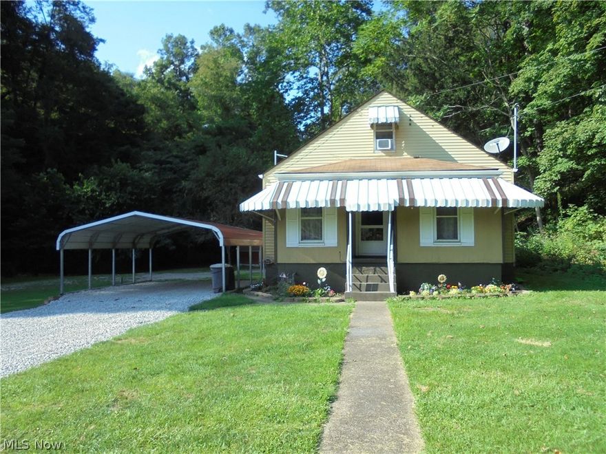 Nestled all by itself !! Come enjoy this home close to everything but private.  This home is being sold as is. Double carport and new driveway. 12x8 shed.  All appliances stay. 2010 furnace and electric updated.  3 window A/C  and dehumidifier stay.