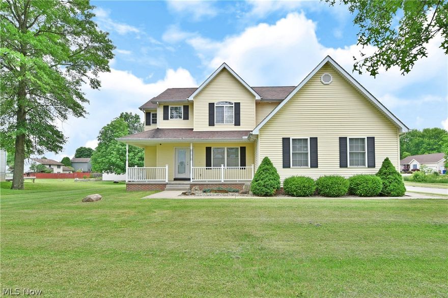 Don’t miss your chance with this exemplary Lordstown residence, presenting a substantial four-bedroom home filled with tastefully modern updates! The provocative corner residence is quick to catch your eye with its expansive lot and strikingly colored exterior. A concrete pathway runs along elegant landscaping as it wraps around to the formal entry. Inside, a grand foyer spans two floors with an ornate light that illuminates the winding staircase. Hardwood styled flooring runs beneath, spilling past the nearby formal dining room. A decadent living room delights with a stone mantle and2022 - D fireplace as the impressive kitchen awaits nearby. Here, casual dining space awaits the rear patio entrance while the kitchen itself looks on with polished stone countertops to include a large center island. A tiled backsplash pairs with the dark nickel appliances and dark hardware. First floor laundry is located aft of a charming half bath and garage entry to complete the floor. Upstairs, four am