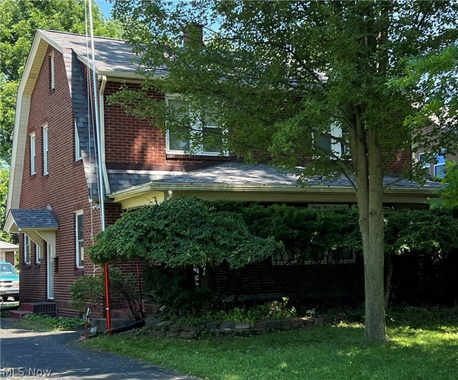 Well maintained 3 bedroom, 1.5 bath, all brick two story home in Youngstown Schools. Spacious living room with a fireplace connected to a full dining room. The kitchen includes a dishwasher, electric range, and refrigerator. This home offers a powered chair lift to both the upstairs and the basement, as well as a curb-less shower with safety bars. Newer roof with architectural style shingles, updated 150 amp service panel, and newer vinyl windows on the second story. The detached two car garage is 20ft by 20ft and has a powered door. There is a full unfinished basement that includes a secondary refrigerator, washer and dryer. A home warranty is being provided for one year of additional coverages. Ready for immediate occupancy.