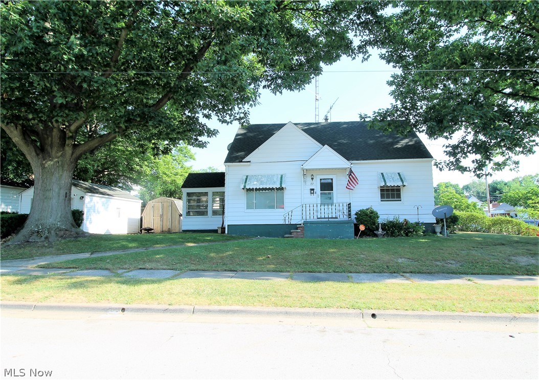 Welcome to this three bedroom, one and half bath cape cod featuring original wood flooring through out the home. From the front porch you enter into the living room that offers a large window to let the natural light to shine through. The bright, eat in kitchen offers a ceiling fan, plenty of cabinets, dishwasher, stove and refrigerator. There is a bright, full bathroom and two bedrooms to finish the main level. Upstairs you will find another large bedroom and an area great for a desk, etc. The lower level is very clean, offers plenty of room to make a work out area, office, plenty of storage space. Outside you will find a patio in the backyard, great space to entertain or just relax, a shed, and a closed in area with indoor/outdoor carpet to enjoy. There is a detached one car garage. So many precious memories begin right here!
