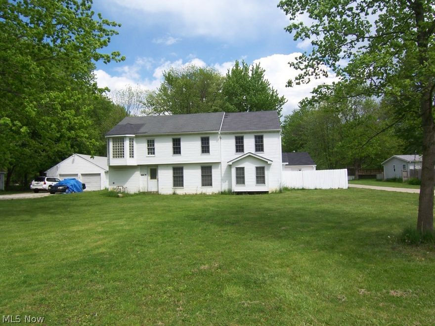 Great piece of property with 2 separate homes on over an acre lot. Main house is a colonial with 2290 sf, 5 bedrooms, 2 full baths, that has been completely gutted and redone. It has new A/C, furnace windows, drywall, insulation, electrical, roof and gutters. House #2 is a ranch home with 1280 sf, 3 bedrooms, 1 bath. Appliances stay in house #2. House #2 has a window A/C unit. There is a phenomenal 20x30 garage at the rear of the property. Rear garage is heated with its own electrical panel, water is ready to be hooked up, and it has a newer overhead garage door. Great potential here if this is what you are looking for...this property backs up to a golf course.