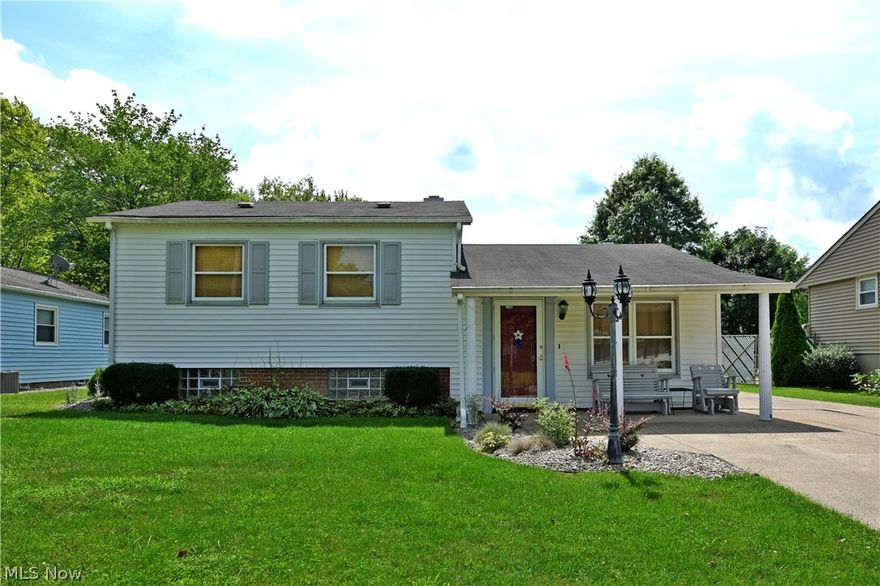 Enjoy this fantastic split-level home, complete with your own private resort out back! This charming property has it all with spacious, well-kept rooms, a stunning great room and a huge in ground pool shrouded in heavy landscaping. A concrete drive leads up to the oversized single entrance garage and pool house while an ornate stone gate leads to the rear patio and covered side awning; perfect for these hot summer days. Inside, a carpeted living room greets you at the foyer to showcase custom closet space and the main stairwells. Nearby, the central formal dining room divides the kitchen as a serving window aids in both nightly dinner and entertainment use. Heavy tile work fills both sides of the galley layout that leads to the showcased great room. Here, gorgeous wood panel ceilings are illuminated by windows facing the pool area as a gas fireplace looks on. Upstairs, a trio of welcoming bedrooms join a stylish full bath with corner vanity. The lower portion of the home includes a fam