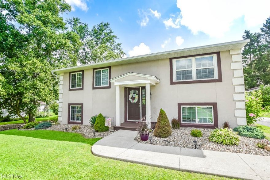 Such a wonderful place to call home!  This stately bi-level impresses the moment you arrive with its low maintenance manicured landscaping. Inside you'll find a comfortable living room that connects to the eat-in kitchen complete with breakfast bar seating, solid surface countertops, stainless steel appliances and plenty of cabinet storage. Down the hall are three well proportioned bedrooms and an updated full bath. The lower level adds a master suite with a walk-in closet and a private full bath. This level walks out to the patio shaded by the upper level deck, spacious backyard and detached two car garage. Nicely updated with a newer furnace, water heater, roof and windows and a great location in Norton City schools!  Call to see this one today!