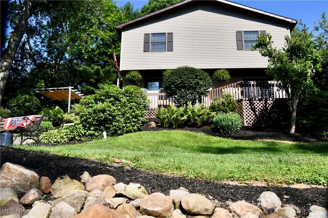 Escape to lakeside living in this beautiful 4-bedroom, 2-bathroom lakefront home featuring panoramic water views and abundant indoor and outdoor space. Enjoy morning coffee or sunset evenings on the front and back decks, or relax on the side patio with views of the serene surroundings. Inside, you’ll find a spacious family room centered around a wood-burning fireplace, a dedicated dining area, and a mud room for added convenience. A striking spiral staircase adds charm and leads to the upper-level bedrooms. This home is part of a vibrant community offering access to tennis courts, community pavilions, a fishing pond, and a swimming lake—perfect for recreation and entertaining guests year-round. Whether you're looking for a full-time residence or vacation home this lakefront gem has it all.