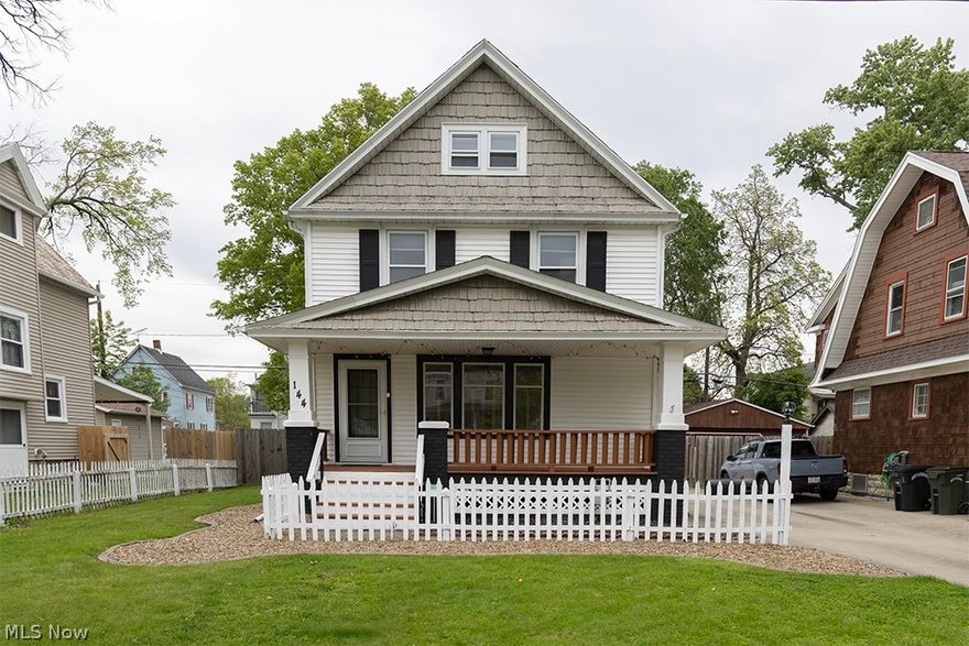 Charming, well-maintained home offering 3 beds, 3 full baths, a perfect blend of character, and space. Curb appeal begins with a large covered front porch, white picket fence, and stone accents. The concrete driveway extends to the rear, providing side-by-side parking and access to the detached 2-car garage ideal for a mechanic or hobbyist, featuring an airline, propane gas heater, window A/C unit, built-in storage, and a refrigerator. A bonus storage room is located behind the garage. The partially fenced backyard is designed for entertaining with a three-tier deck complete with bar and barstools, plus an exterior hose spigot for vehicle washing. Inside, you'll find a open-concept living and dining area featuring vinyl flooring, beautiful original woodwork, built-in corner shelving, and stained-glass windows. The kitchen comes fully equipped with garbage disposal, microwave, gas range, refrigerator, dishwasher (2025), backsplash, oak cabinetry, updated lighting, and a large crank-out window above the sink. The main floor also offers a 2nd family room with ceiling fan, sliding glass doors to the rear deck, a full bath, capped gas line for future use, and a 3rd exterior entrance off the kitchen. Upstairs offers an updated full bath with walk-in shower, built-in storage, elevated vanity, and access to a private balcony. The primary bed (17x11) offers original hardwood floors, two cedar-lined closets, and ceiling fan. Additional bed include an 11x10 second-floor bed and a large third-floor bed (25x8) with wood floors and built-in storage. The finished basement adds even more living space with vinyl flooring, drop ceiling, glass block windows, a 9x16 rec room, 16x24 utility room with washer and dryer (2024), wash tub, and a 3rd full bath with stand-up shower. Additional features include forced-air gas heat, central air, 40-gallon hot water tank, whole-house water softener, abundant storage, security system capability, and a 1-yr Home Warranty for added peace of mind.