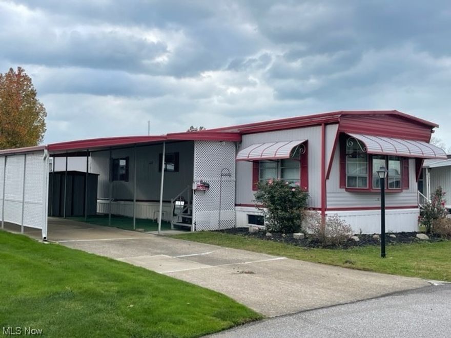 This lovingly maintained mobile home is a true gem, offering the perfect blend of comfort and convenience. Nestled in a tranquil neighborhood, this delightful property boasts an inviting atmosphere that will make you feel right at home. As you enter, you'll be greeted by a spacious and sunlit living area, enhanced by a  bay window, newer carpet throughout and freshly painted! The built-in buffet in the dining area adds a custom touch, providing both extra storage and a wonderful space to showcase your favorite decor. Preparing meals will be a breeze on the gas stove, and the pantry closet ensures you have all the storage space you need to keep your kitchen organized. Outside, you'll find a neatly-landscaped yard, a covered carport, and additional storage shed. Don't miss the opportunity to experience the relaxed and enjoyable lifestyle this 55+ community has to offer. Contact us today to schedule a viewing and make this mobile home your own!