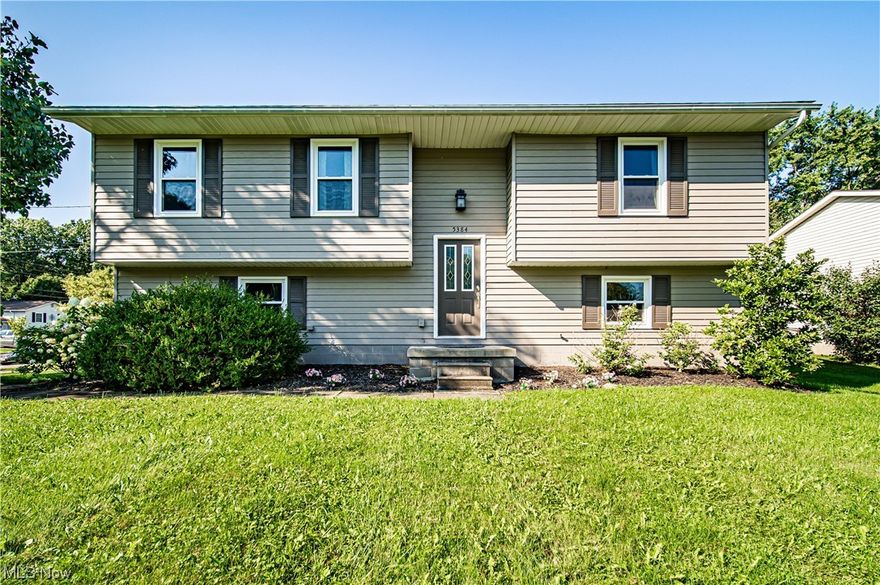 Welcome home to this updated 3 bedroom home in Stow! This beautiful home sits on a large corner lot and offers a spacious open floor plan, stainless steel appliances, and plenty of light with the many windows. On the main floor, you will find three bedrooms and a large main bath which features a tiled shower. The fully finished lower level offers endless possibilities, complete with another full bathroom and a large living space that opens up to the patio and backyard. The large backyard is perfect for relaxing or entertaining and is complete with a shed for storage, as well as a large 2 car garage. Close to tons of shopping and restaurants, all that's left to do is move in! Seller offering a 12 Month Temporary Buydown to lower the buyers payment for the first 12 months.