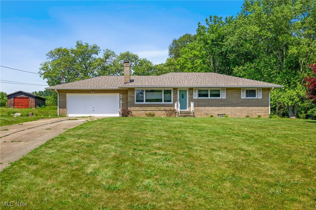Welcome home to this one-owner brick Ranch on 0.57 acres at the end of the cul-de-sac in a beautiful New Franklin Twp neighborhood! The home features a large front window that pours lots of natural light into the spacious living room, which has a lovely brick fireplace to keep everyone cozy at night. The kitchen has been well-maintained and has solid oak cabinetry in great condition. The dining area boasts gorgeous hardwood flooring and access to the huge backyard through a newer sliding glass door. This Hardwood flooring can be found throughout the home, including under the carpeted living room and master bedroom. The 3 bedrooms are large and provide ample closet space. The master bedroom has an attached full bathroom as well. The lower level has been freshly painted for the new owners and includes about 600 sqft of finished space. The roof and windows have all been replaced within the last 5 years. This property also includes the 0.57-acre lot with a large wood shed on the other side of the house, totaling 1.14 acres with the sale. This home has been lovingly cared for by the same owner for over 50 years, and now it's your turn.