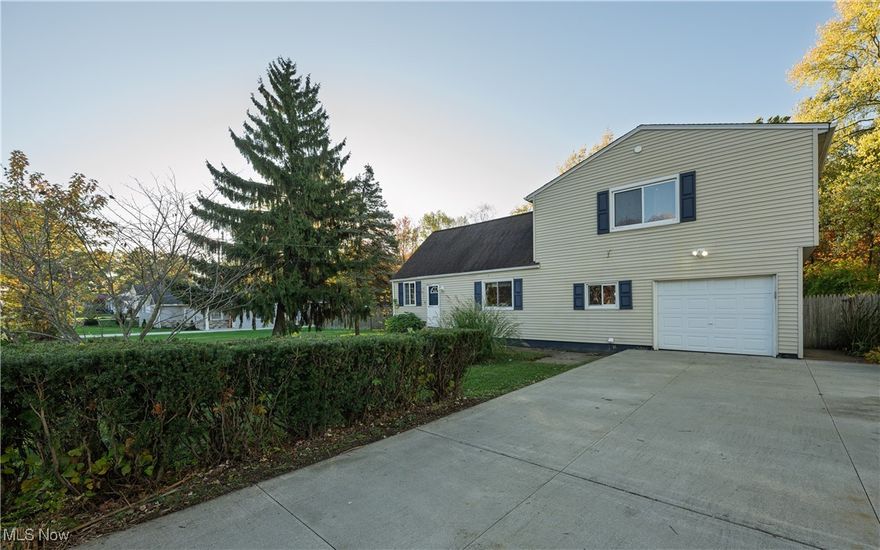 Welcome to this spacious 4 bed, 3 bathroom home, with nearly 1600 sq ft in Akron Springfield OH. This property boasts a fenced in double lot and a very large  25x43 detached 4 car garage out back (heated), making this the perfect place for a handyman, car enthusiast or contractor. Enter the living room and it opens to a sliding glass door out to a beautiful new deck (2025). The kitchen was remodeled in 2008 with new kitchen cabinets, countertops, and flooring. The kitchen opens to a family room with another sliding glass door out to the deck. There is a first-floor bedroom and full bath. Upstairs there is an enormous master bedroom with a private bath, two more bedrooms, another full bath, and a large bonus areas for whatever your family may need. There is a first floor laundry room and newer concrete driveway! This home has so much to offer and is conveniently located close to everything in the Akron area. On a dead end round butting into Springfield Lake. Schedule your showing today!