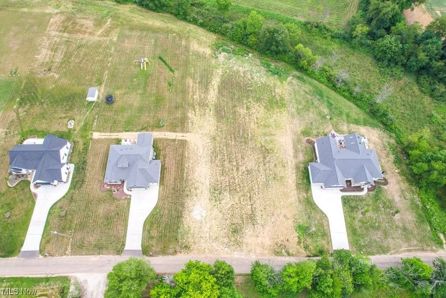 LOT #4: Buildable 1+ acre lot within Green Local Schools ready for your dream home with an award winning custom homebuilder. NO HOA - developed by Shultz Design & Construction. Fully prepped and approved for well & septic. Great location less than 2 miles to I77, close to schools, but quiet and surrounded by beautiful homes. Building contingency set with Shultz Design & Construction.