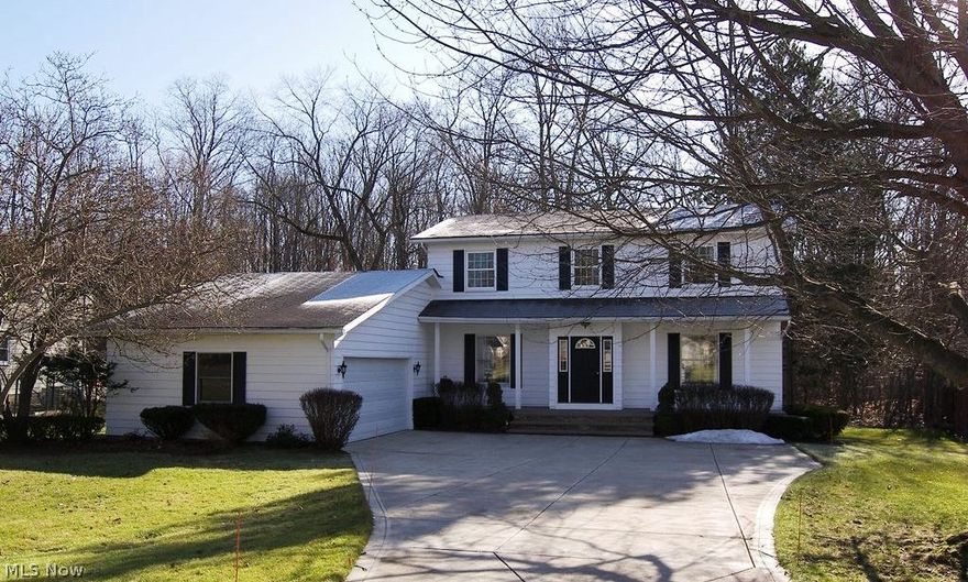 Welcome to this pretty colonial situated on an almost 3/4 acre treed lot with a newer driveway and garage door (2013) and ready for you to move right in.  There is a formal living room with a fireplace and a formal dining room, as well as a spacious family room open to the kitchen which includes a good amount of cabinet space, granite countertops and an eating area with a door to the deck and backyard. There is an updated half bath on the first floor with granite countertop.   All four bedrooms are on the second floor with the master suite having its own bath, and there is a hall bath both with granite countertops.   Updates include:  newer carpeting, some newer windows, furnace 2007.  Plenty of room for storage in the full basement.  Ready to move right in and walk to the schools and playground – close proximity to the freeway.