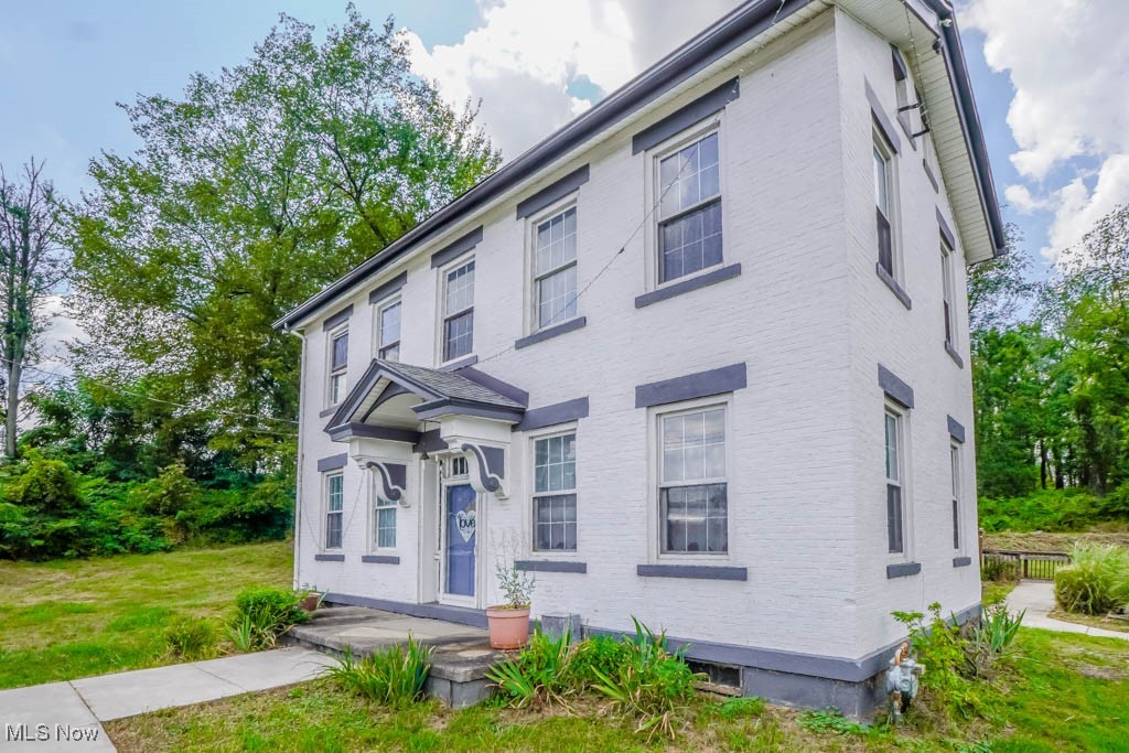 Built in 1835, the Peter Pontius House is believed to be one of the oldest homes in the county! This Federal style farmhouse offers 2604 square feet and has been updated with modern touches while preserving original details like hardwood floors, wide moldings, and exposed brick accent walls. A stone fireplace anchors the living room, and a front den or parlor adds extra space for relaxing or working from home. A massive dining area connects to the hearth room with a wood burning fireplace, brick surround, and built in bookcase. Nearby, the kitchen features a tile countertop, tin ceiling, and good cabinet storage, with the refrigerator tucked into a butler’s pantry that also works as a mudroom with side entry. In the family room, a vaulted beamed ceiling, built in desk, wall of closets, and French doors to a huge back deck make it a great spot for gatherings. A half bath completes the main level. Upstairs, you’ll find two comfortable bedrooms and a full bath with a step in shower. Updates include a newer roof, electric panel, hot water tank, water supply lines, deck, and sidewalks. The home is being sold with one acre, with the option to purchase additional land. A wonderful opportunity to create your own vision while enjoying the history and character of this special home. Call today!