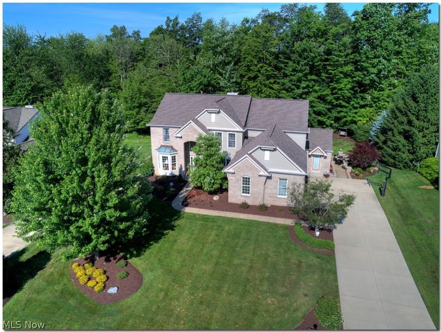 Welcome Home! Step Into Two Story Foyer, True Center Hall With Formal Living Room On Left, Formal Dining Room On Right, Split Staircase, First Floor Den, Great Room With Fireplace and Floor To Ceiling Windows. Large Eat In Kitchen With Granite Counters, Island and Work Station. Continuing On First Floor Is Super Sized Laundry Room and Mud Room With Ceramic Floors. All Other Flooring On Main Level Is Hardwood. Four Generous Sized Bedrooms Up, Master With Walk In Closet, Separate Vanities, Soaker Tub and Walk In Shower. Guest Bedroom With Full Bath and Family Bath. Finished Lower Level With Garden Windows, Recreation Room, Office, Extra Guest Bedroom With Egress Window and Full Bath. Room For Exercise and Plenty Of Unfinished Storage. Over 3800 Square Feet Plus Almost 1800 Finished Square Feet In Lower Level. Private Back Yard Surrounded By Trees With Golf Course View. Additional Backyard Features, 50x21 Paver Patio With Sitting Wall, 26x14 Azek Deck, Outdoor Lighting and Pergula On Pati