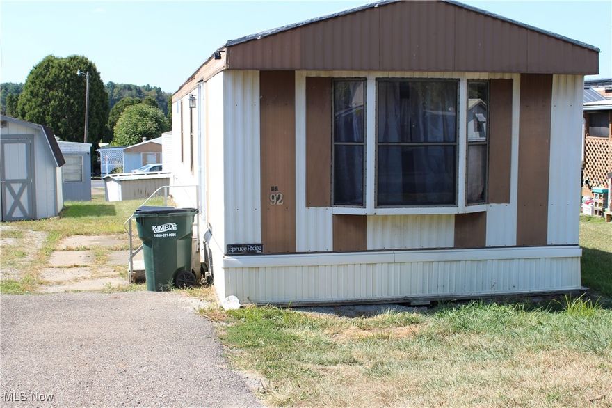 Very nice 2 BR, 1 Bath mobile in Beth MH Park.  Lot rent includes trash, sewer, water, cable/internet.  Many updates since 2022 including floors, paint, cabinetry, re-tarred roof.  Spacious kitchen/great room.  Appliances stay including dishwasher (2024), gas stove, stackable washer/dryer, along with storage shed.  Very comfy and convenient to just about anywhere in Stark County!  Extra long drive for parking!