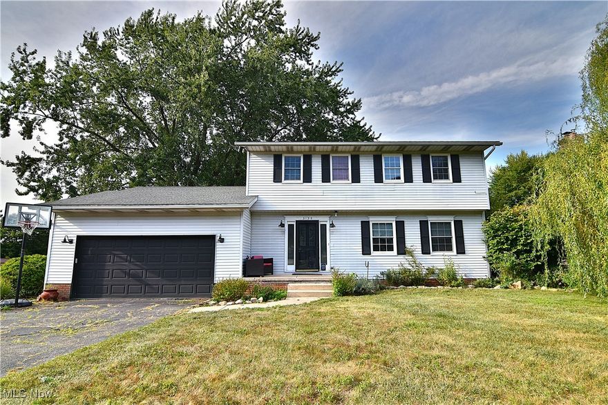 Welcome to this spacious 4-bedroom, 2.5-bath home in the desirable Emerald Hills neighborhood of Uniontown, located in the Lake Local School District. Situated on a raised corner lot with natural privacy, this 2-story home offers a wonderful blend of comfort and function. The heart of the home features an open-concept kitchen, dinette, and family room—perfect for everyday living and entertaining. A formal dining room and a good-sized living room provide additional space for gatherings. Upstairs, the primary suite offers a generous layout with its own private bath. The partially finished basement adds bonus living or recreation space. Outdoors, enjoy the large deck and concrete patio overlooking the backyard, ideal for entertaining or relaxing.