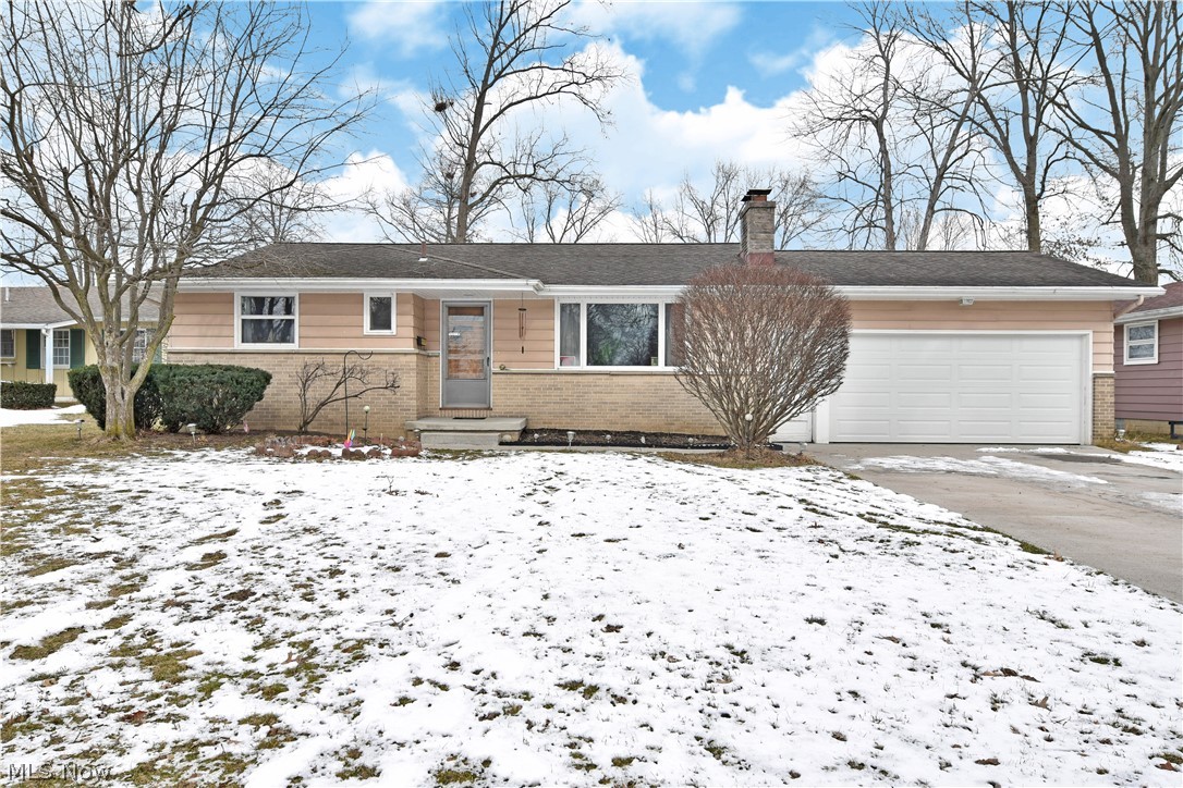 Don’t overlook this cozy three-bedroom Warren ranch, as it’s an opportunity you won’t want to miss! Packed with a spacious layout to include a delightful sunroom and a massive, finished basement; the potential here is endless. A handsome exterior features a half brick façade paired with a covered front patio and concrete driveway. Around back, the ample backyard is home to a fantastic rear patio area, easy accessed from the attached two car garage. The carpeted living room welcomes you through the door as you’ll quickly spot the brick fireplace, bathed in sunlight from the large picture window. An expansive central kitchen includes eat-in dining and built-in storage as the sweeping countertops divide the natural wood cabinets. Sliding doors lend to the finished sunroom; a great place to enjoy scenic meals all year round. Unique, bifold doors separate the kitchen from the main hall. Three spacious bedrooms include a brightly tiled full bath found at the end of the hall. The master bedro